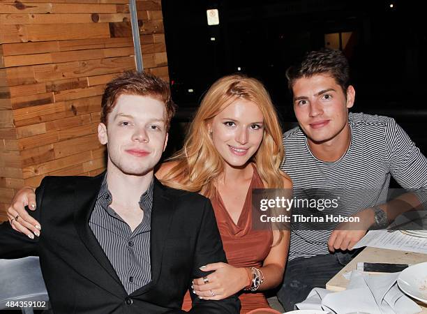 Cameron Monaghan, Bella Thorne and Gregg Sulkin attend Monaghan's birthday dinner at The District by Hannah An on August 15, 2015 in Los Angeles,...