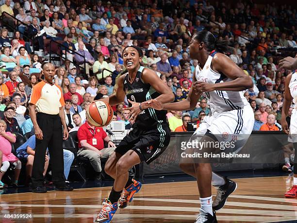 Candice Wiggins of the New York Liberty drives to the basket against the Connecticut Sun on August 14, 2015 in Uncasville, Connecticut. NOTE TO USER:...