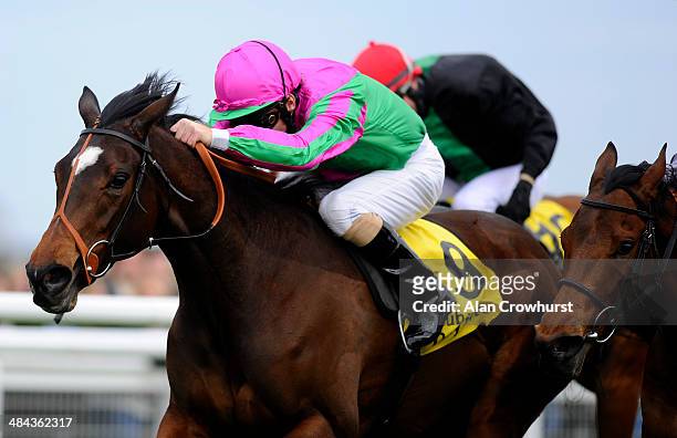 Jimmy Fortune riding J Wonder win the Dubai Duty Free Stakes at Newbury racecourse on April 12, 2014 in Newbury, England.