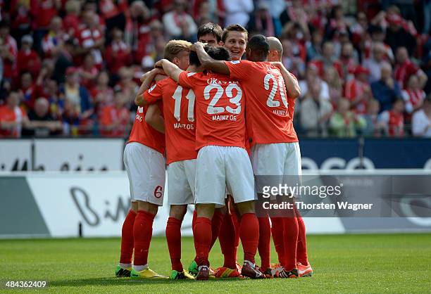 Players of Mainz celebrates after Nils Peteresen of Bremen is scoring the 1-0 with a own goal during the Bundesliga match between FSV Mainz 05 and SV...