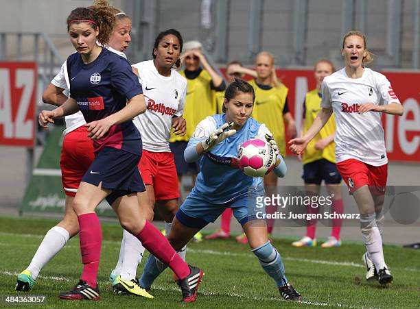 Goalkeeper Lisa Weiss of Essen grabs the ball during the women's DFB Cup semi final between SGS Essen and SC Freiburg on April 12, 2014 in Essen,...