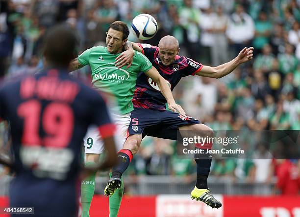 Nolan Roux of Saint-Etienne and Nicolas Pallois of Bordeaux in action during the French Ligue 1 match between AS Saint-Etienne and FC Girondins de...