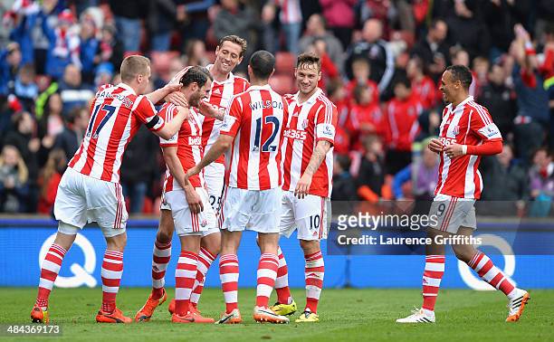 Erik Pieters of Stoke City is mobbed after scoring a first half goal during the Barclays Premier League match between Stoke City and Newcastle United...