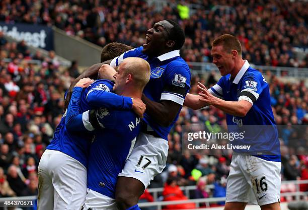 Steven Naismith, Romelu Lukaku and James McCarthy of Everton celebrate after Wes Brown of Sunderland scores an own goal during the Barclays Premier...