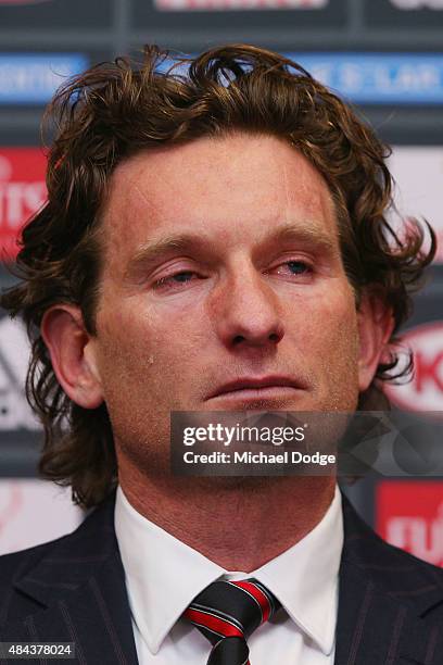 Bombers head coach James Hird cries as he talks to the media following the announcement of his resignation as head coach at True Vaule Solar Centre...