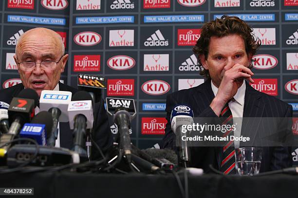 Bombers head coach James Hird cries next to Bombers Chairman Paul Little after he announced to the media of his resignation as head coach at True...