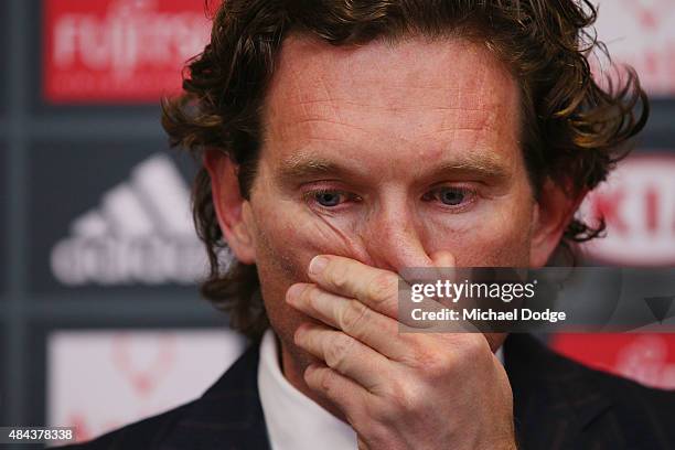 Bombers head coach James Hird cries as he talks to the media following the announcement of his resignation as head coach at True Vaule Solar Centre...