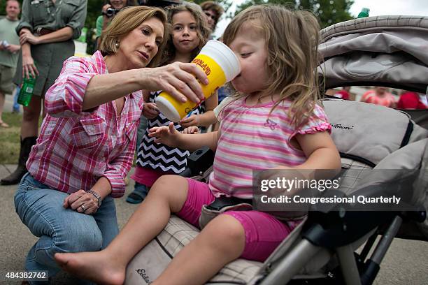 August 17: Republican presidential candidate Carly Fiorina shares her "diabetic lemonade" with Teresa Tehoke as her sister, Maire watches at the Iowa...