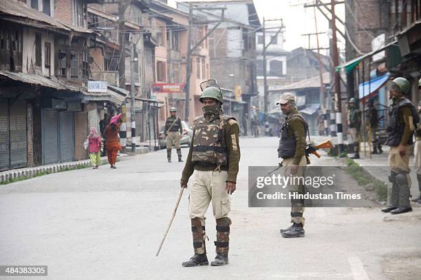 Paramilatary soldiers stand guard during restrictions in old city of Srinagar, as Mirwaiz Umer Farooq, chairman of the separatist moderate Hurriyat...
