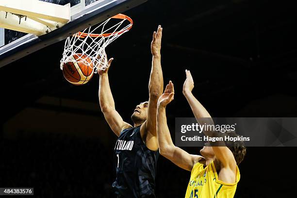 Mika Vukona of the Tall Blacks scores past the defence of Ryan Broekhoff of the Boomers during the game two match between the New Zealand Tall Blacks...