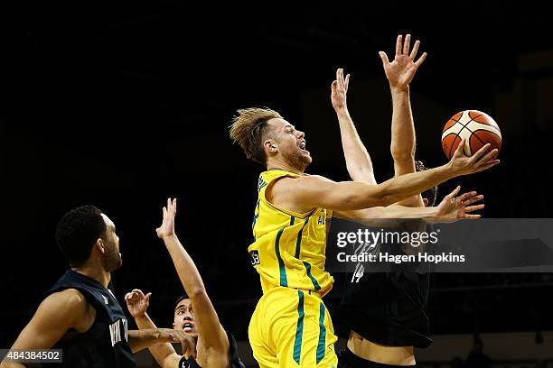 Brad Newley of the Boomers shoots past Robert Loe of the Tall Blacks during the game two match between the New Zealand Tall Blacks and Australian...