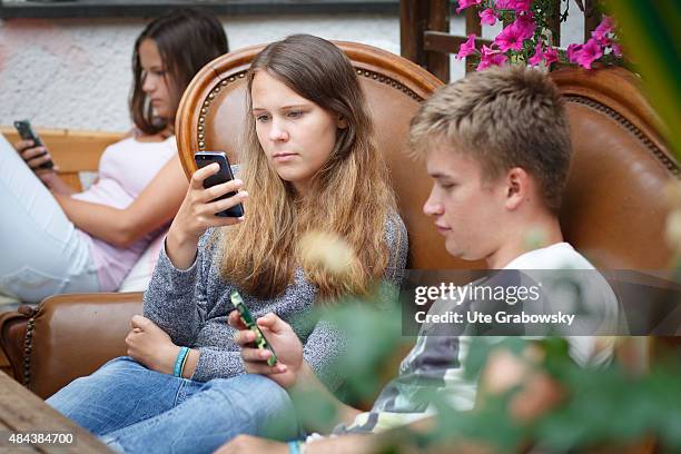 Germany Young couple sitting on a couch staying outside in the garden on August 10, 2015 in Bonn, Germany.