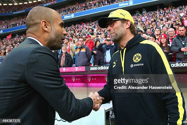 Josep Guardiola, head coach of Muenchen shake hands with Juergen Klopp , head coachof Dortmund prior to the Bundesliga match between FC Bayern...