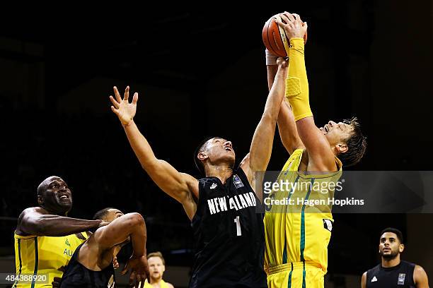 Reuben Te Rangi of the Tall Blacks and David Andersen of the Boomers compete for the ball during the game two match between the New Zealand Tall...