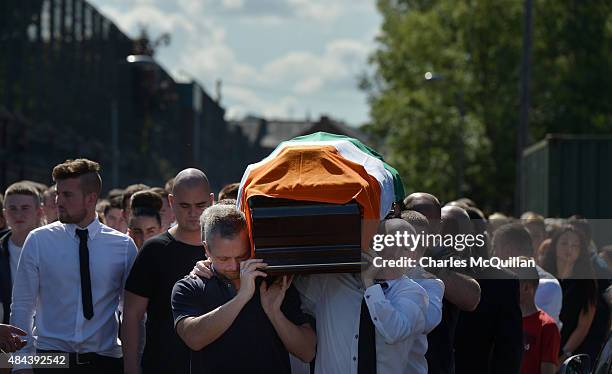 The casket is carried as the funeral takes place of former IRA member Kevin McGuigan Sr on August 18, 2015 in Belfast, Northern Ireland. The father...