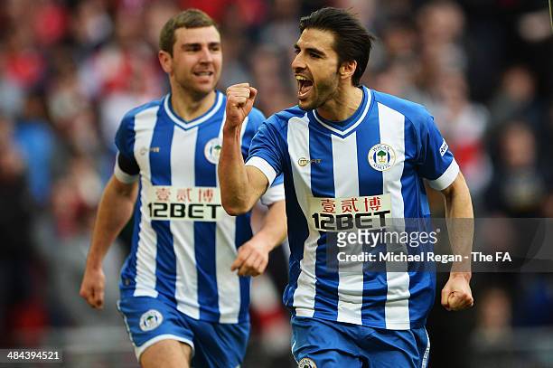 Jordi Gomez of Wigan Athletic celebrates with team-mate James McArthur after scoring a goal from the penalty spot during the FA Cup Semi-Final match...