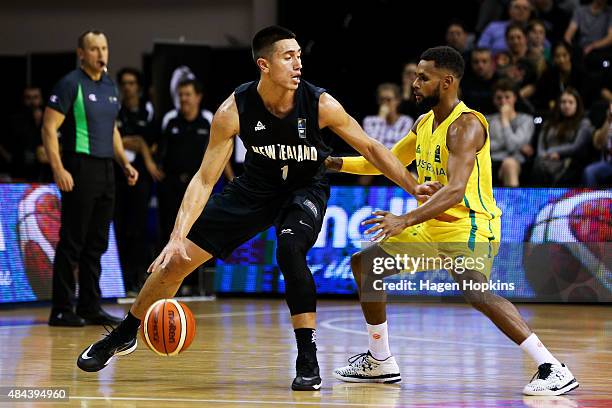 Reuben Te Rangi of the Tall Blacks holds off Patty Mills of the Boomers during the game two match between the New Zealand Tall Blacks and Australian...