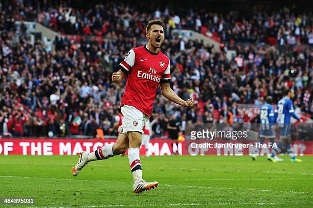 Aaron Ramsey of Arsenal celebrates after team-mate Per Mertesacker scores a goal during the FA Cup Semi-Final match between Wigan Athletic and...