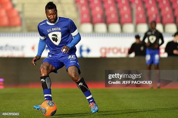 Bastia's French forward Djibril Cisse warms up before the French L1 football match betzeen Evian Thonon Gaillard and SC Bastia, on April 12 at the...