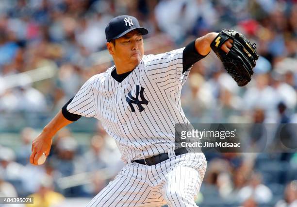Hiroki Kuroda of the New York Yankees delivers a first inning pitch against the Boston Red Sox at Yankee Stadium on April 12, 2014 in the Bronx...