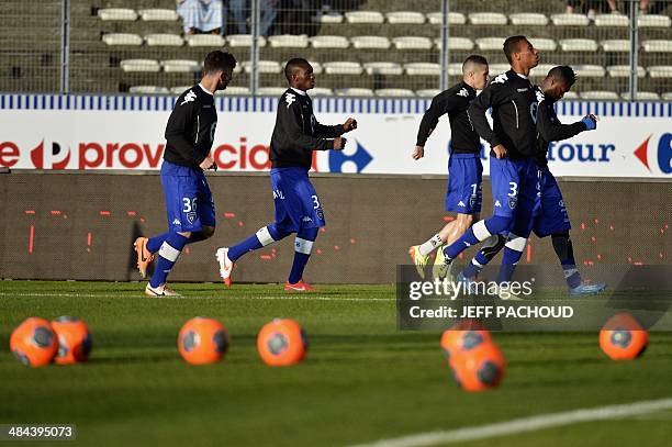 Bastia players warm up before the French L1 football match betzeen Evian Thonon Gaillard and SC Bastia, on April 12 at the Parc des sports stadium in...