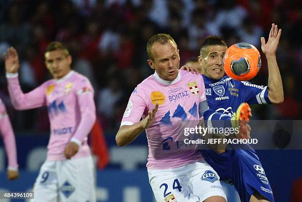 Bastia's French midfielder Florian Raspentino vies with Evian's French midfielder Olivier Sorlin during the French L1 football match between Evian...