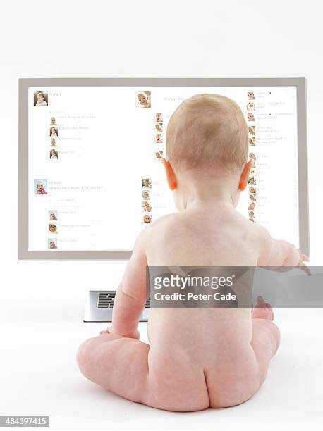 baby looking at social network on computer screen - ass boy stock pictures, royalty-free photos & images