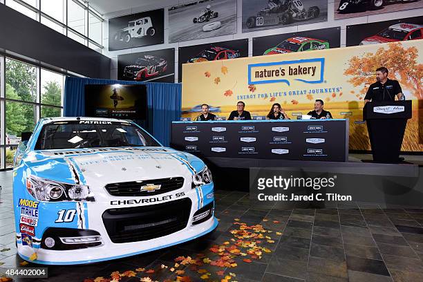 Sam and Dave Marson, co-founders of Nature's Bakery, Danica Patrick, driver of the Stewart-Haas Racing Chevrolet, and Tony Stewart, co-owner of...