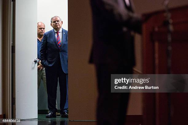 Senator Bob Menendez waits off stage before giving a speech announcing he will not support President Obama's Iran nuclear deal at Seton Hall...