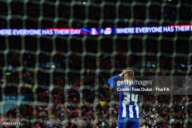 Jack Collison of Wigan Athletic reacts after missing a penalty in the penalty shoot-out during the FA Cup Semi-Final match between Wigan Athletic and...