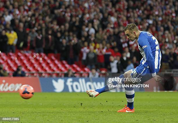 Wigan Athletic's Welsh midfielder Jack Collison fails to score his penalty during the penalty shootout in the English FA Cup Semi-final match between...