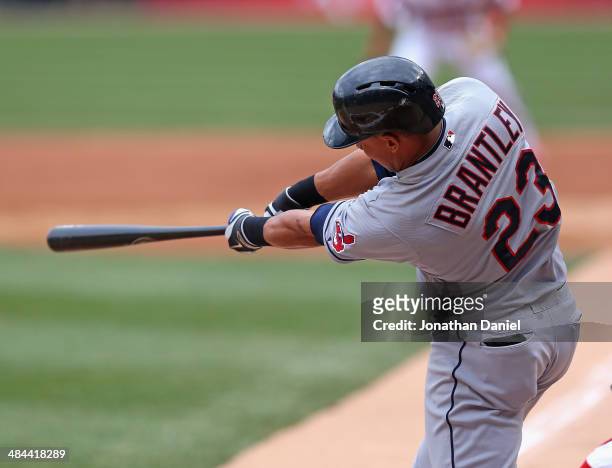 Michael Brantley of the Cleveland Indians hits a two-run single in the 1st inning against the Chicago White Sox at U.S. Cellular Field on April 12,...