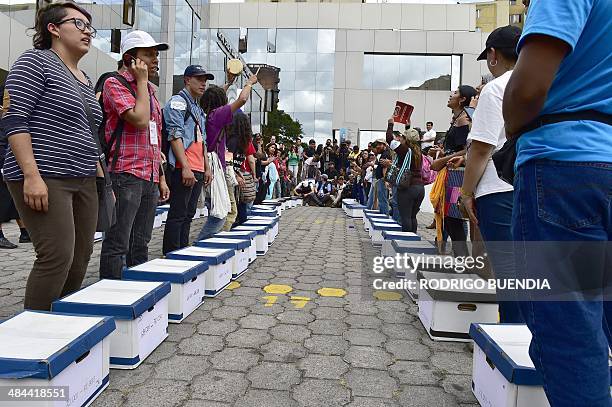 Huaorani natives and Yasunidos ecologist group activists arrive in Quito on April 12, 2014 at the National Electoral Council to leave the signatures...