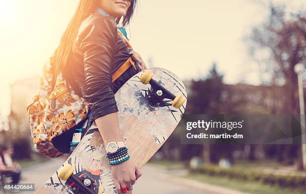 teenage girl with skateboard in the park - skater girl stock pictures, royalty-free photos & images