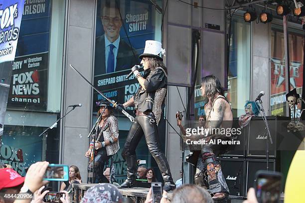 Alice Cooper waves a sword when he performs during "FOX & Friends" All American Concert Series outside of FOX Studios on August 14, 2015 in New York...
