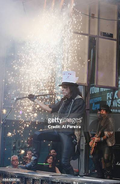 Alice Cooper is amid a curtain of sparks when he performs during "FOX & Friends" All American Concert Series outside of FOX Studios on August 14,...