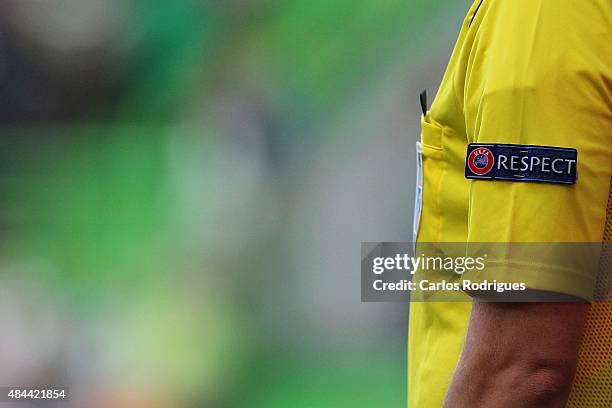 Respect logo UEFA referee during the UEFA Champions League qualifying round play-off first leg match between Sporting CP and CSKA Moscow at Estadio...