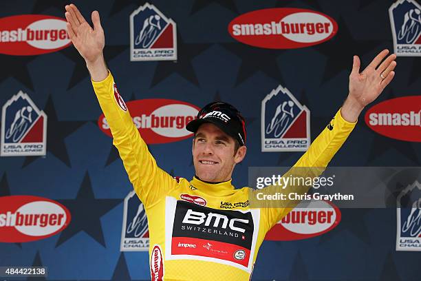 Brent Bookwalter of the United States riding for BMC Racing celebrates after winning the stage and taking the yellow leader's jersey after stage two...
