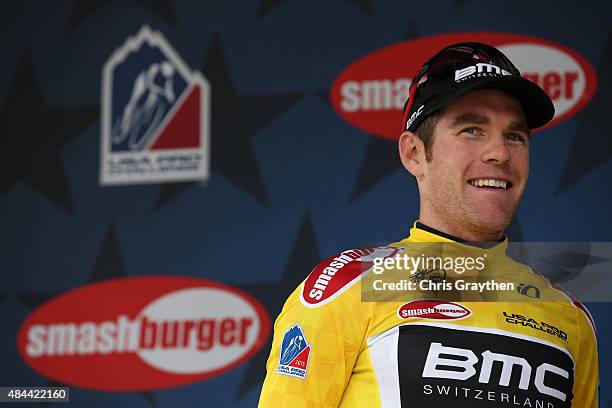 Brent Bookwalter of the United States riding for BMC Racing celebrates after winning the stage and taking the yellow leader's jersey after stage two...