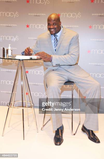 Shaquille O'Neal signs autographs at the collection launch of his new men's clothing line at Macy's Herald Square on April 12, 2014 in New York City.