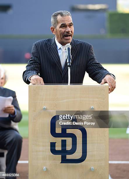 Former San Diego Padres catcher Benito Santiago speaks as he's inducted into the San Diego Padres Hall of Fame before a baseball game between the...