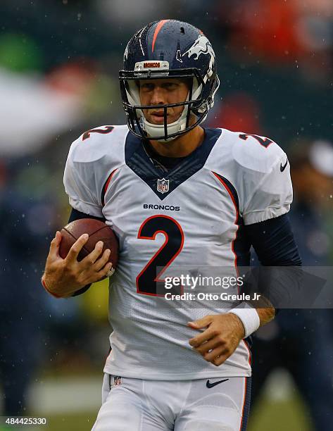 Quarterback Zac Dysert of the Denver Broncos warms up prior to the game against the Seattle Seahawks at CenturyLink Field on August 14, 2015 in...