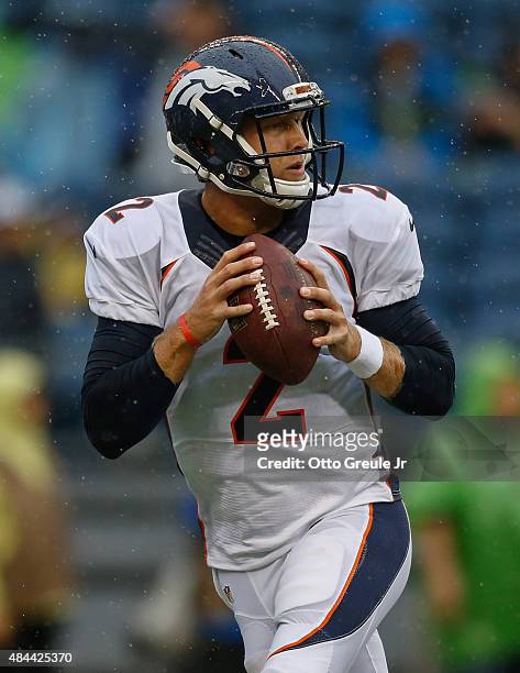 Quarterback Zac Dysert of the Denver Broncos warms up prior to the game against the Seattle Seahawks at CenturyLink Field on August 14, 2015 in...