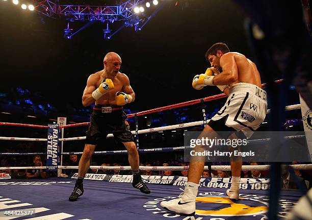 Sergey Khomitsky knocks back Frank Buglioni to win their WBO European Super-Middleweight Championship bout at The Copper Box on April 12, 2014 in...