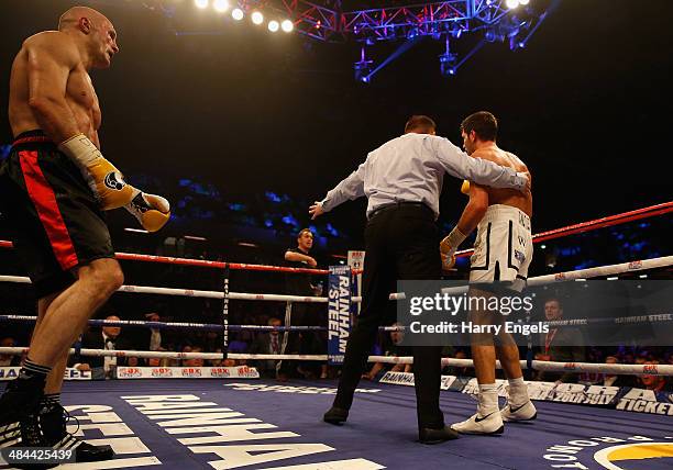 Sergey Khomitsky looks on as Frank Buglioni is forced to stop during their WBO European Super-Middleweight Championship bout at The Copper Box on...