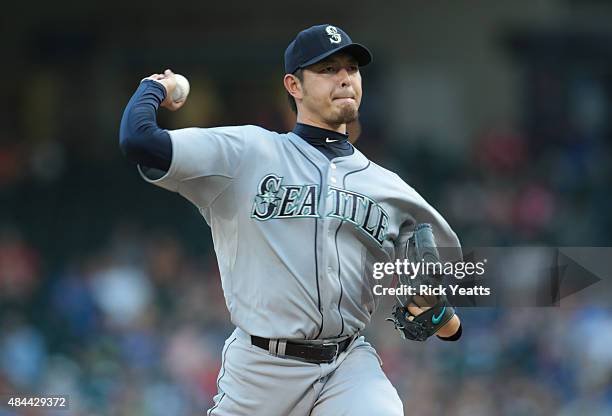 Hisashi Iwakuma of the Seattle Mariners throws in the first inning against the Texas Rangers at Global Life Park in Arlington on August 18, 2015 in...