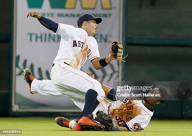Carlos Correa and Carlos Gomez of the Houston Astros collide in center field in the seventh inning during their game against the Tampa Bay Rays at...