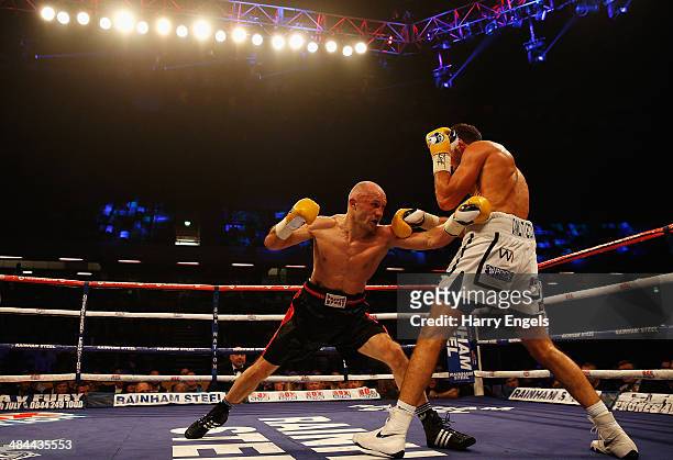 Sergey Khomitsky and Frank Buglioni in action during their WBO European Super-Middleweight Championship bout at The Copper Box on April 12, 2014 in...