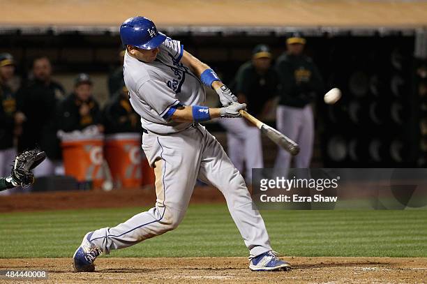 Ellis of the Los Angeles Dodgers hits a three-run home run in the eighth inning of their game against the Oakland Athletics at O.co Coliseum on...