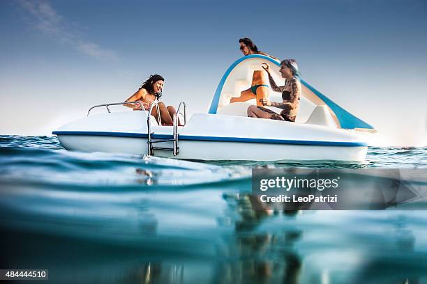 best friend enjoying summer and pedalo fun - pedal boat stock pictures, royalty-free photos & images